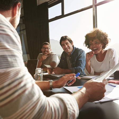 people talking at a office table